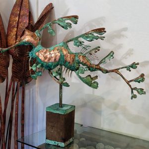 sculpture - copper verdi leafy sea dragon on a wooden block